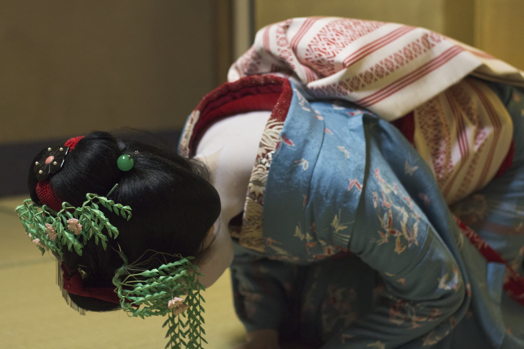 geisha bowing to guests in japan