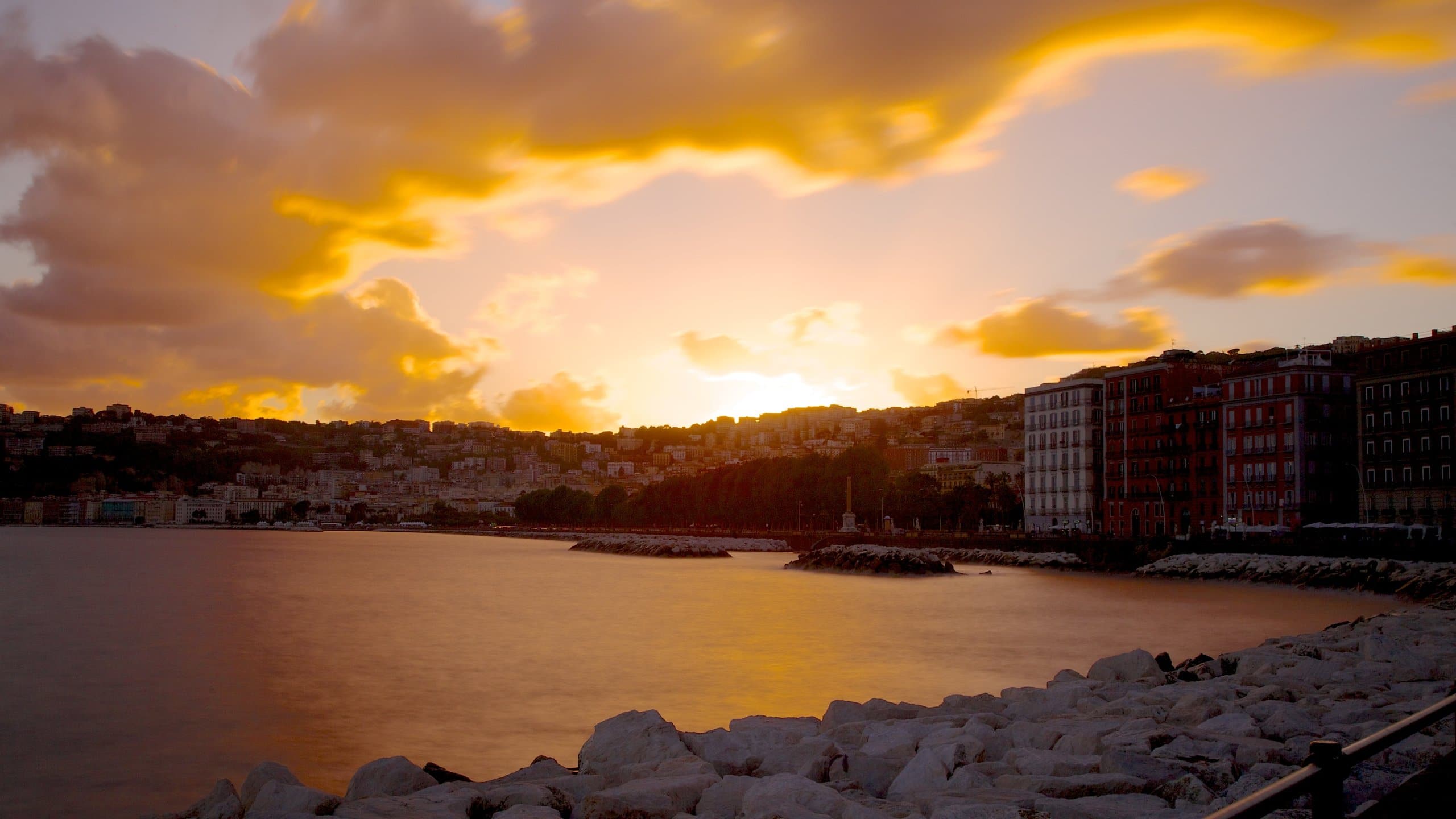 Sunset over the water in Naples