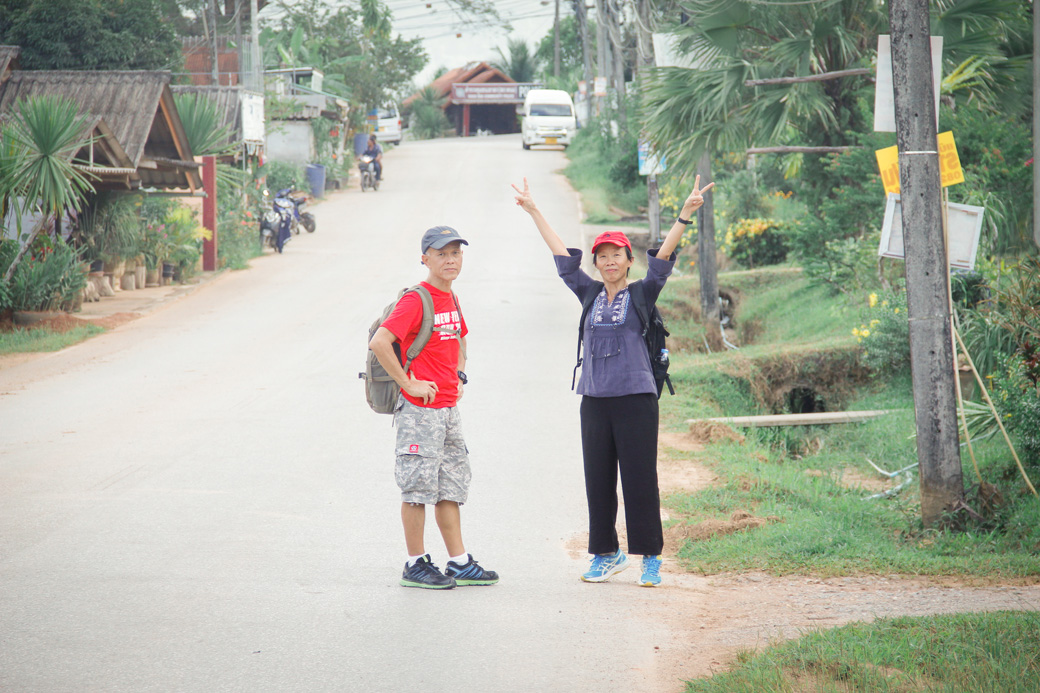 Parents trekking to the viewpoint at Khao Sok National Park