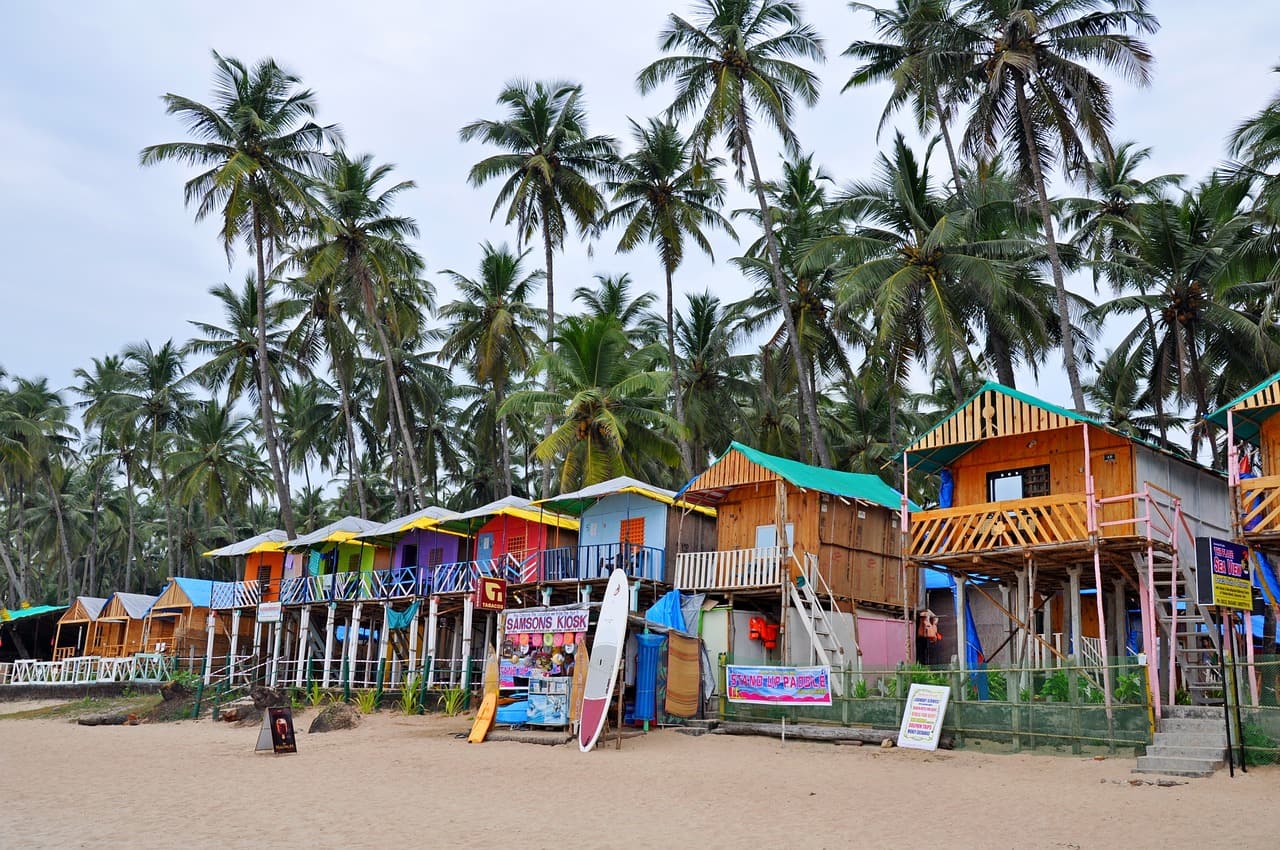 colourful wooden houses on beach goa