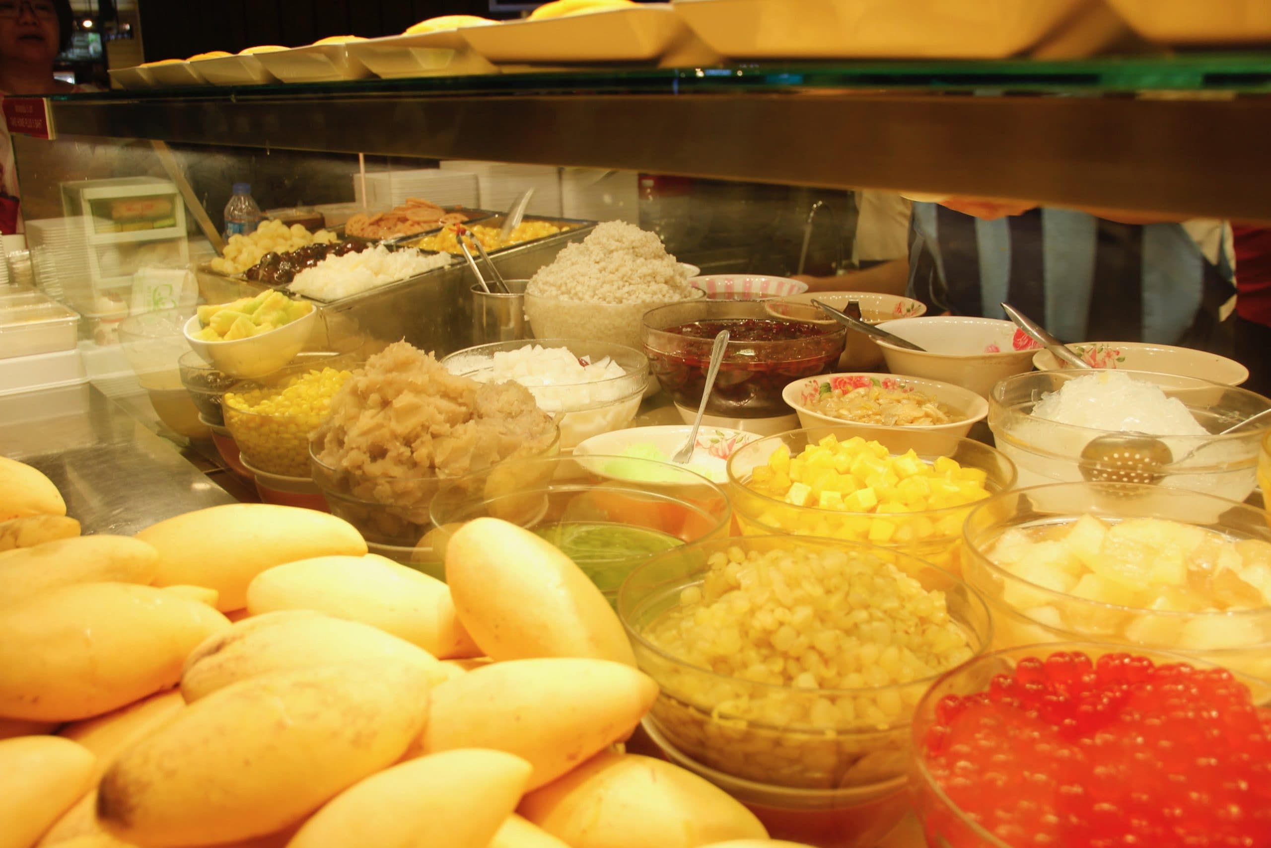 A counter of Cheng tng toppings to choose from