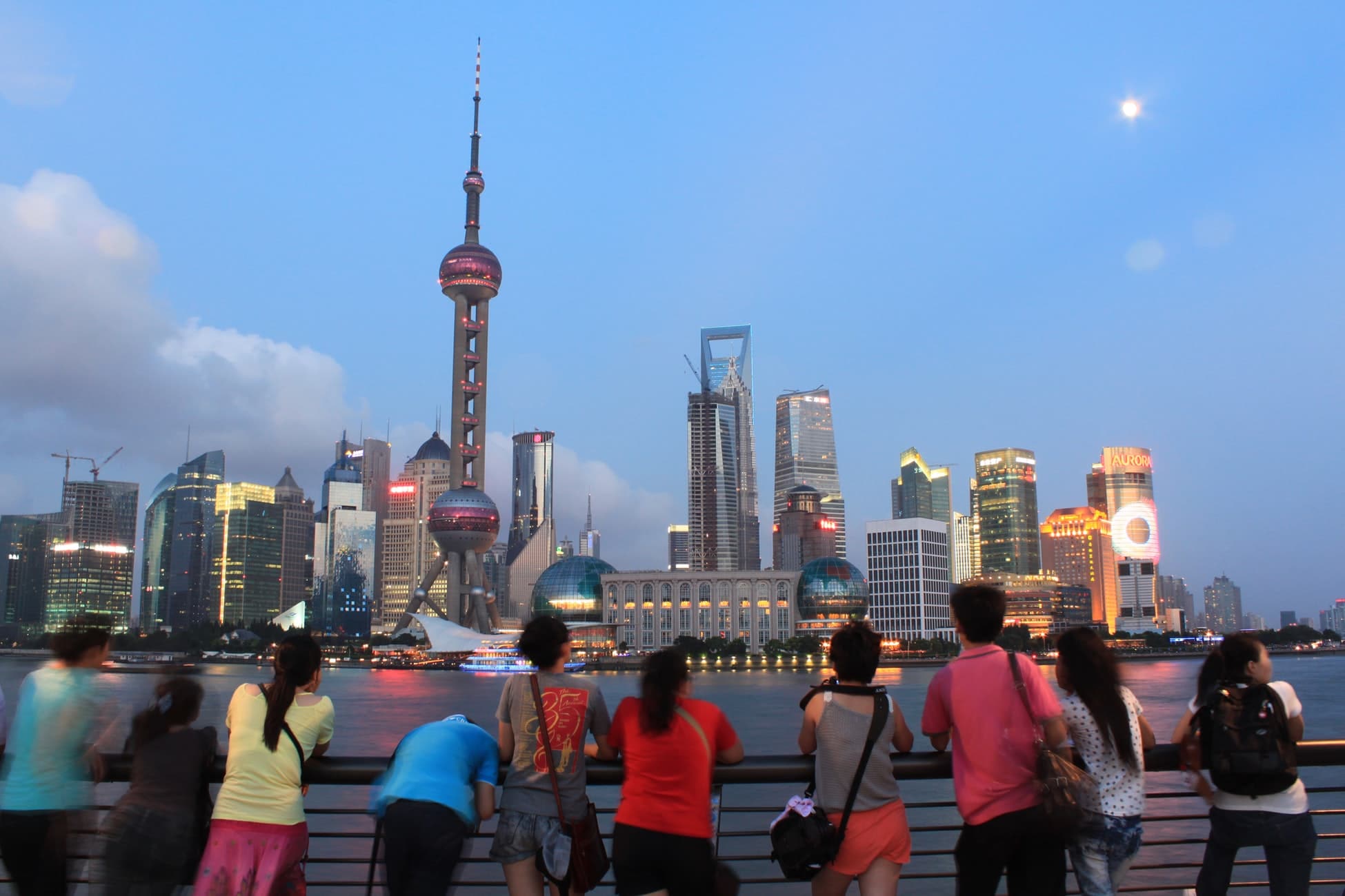 people looking at shanghai buildings