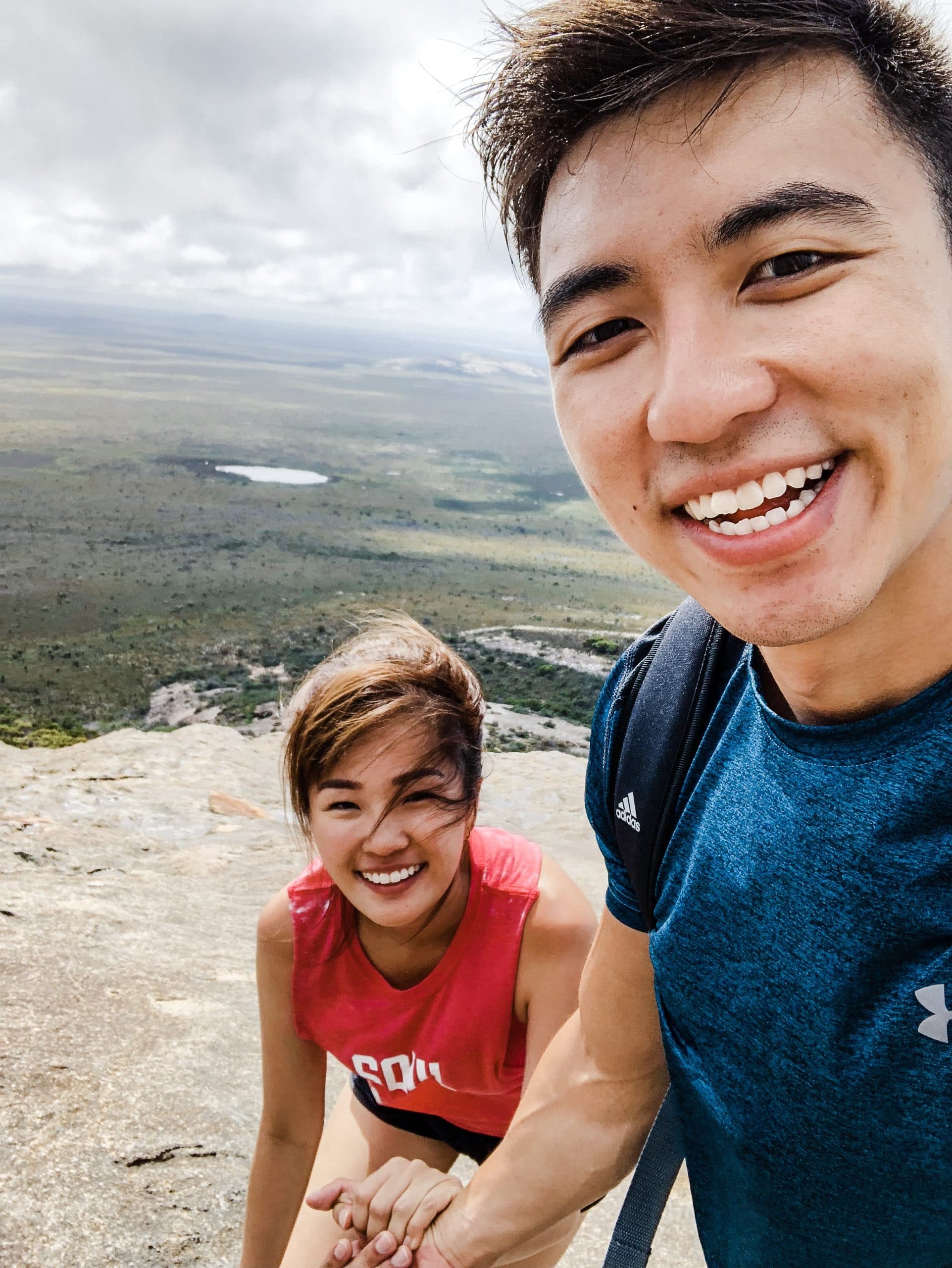 Selfie holding hands on a mountain