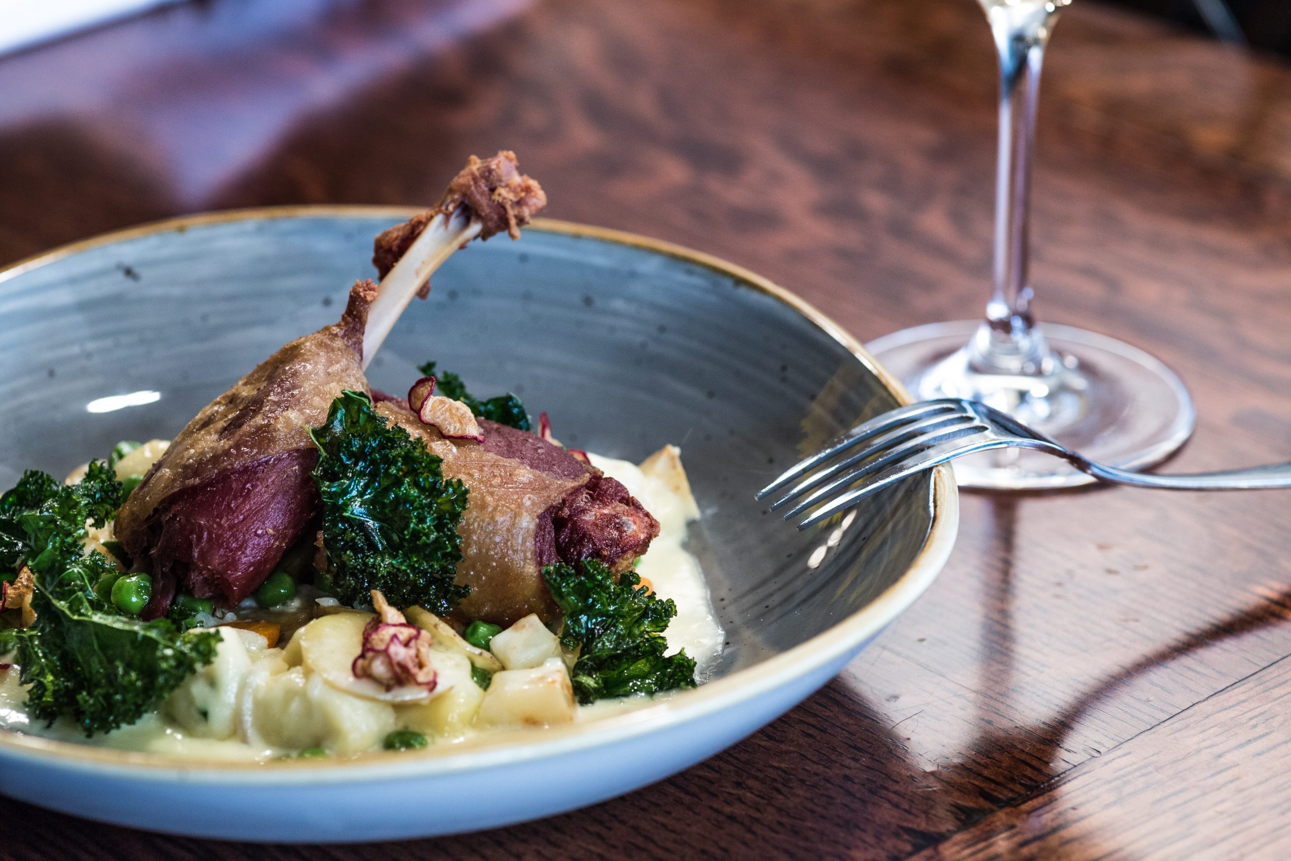 Duck confit dish at a restaurant in Paris