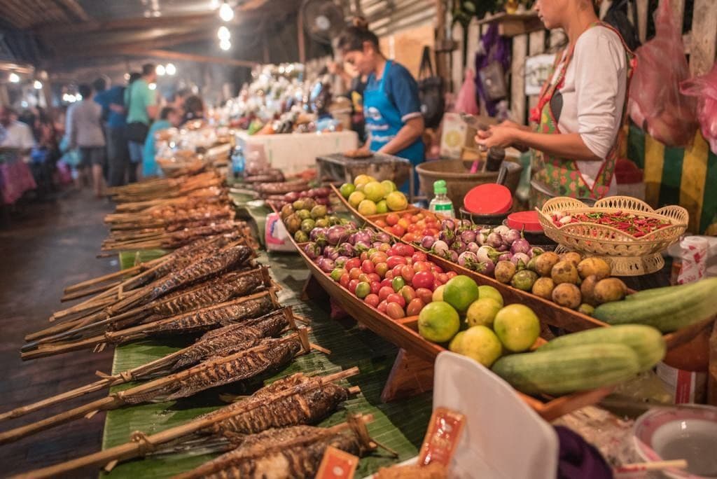grilled skewered fish displayed at market