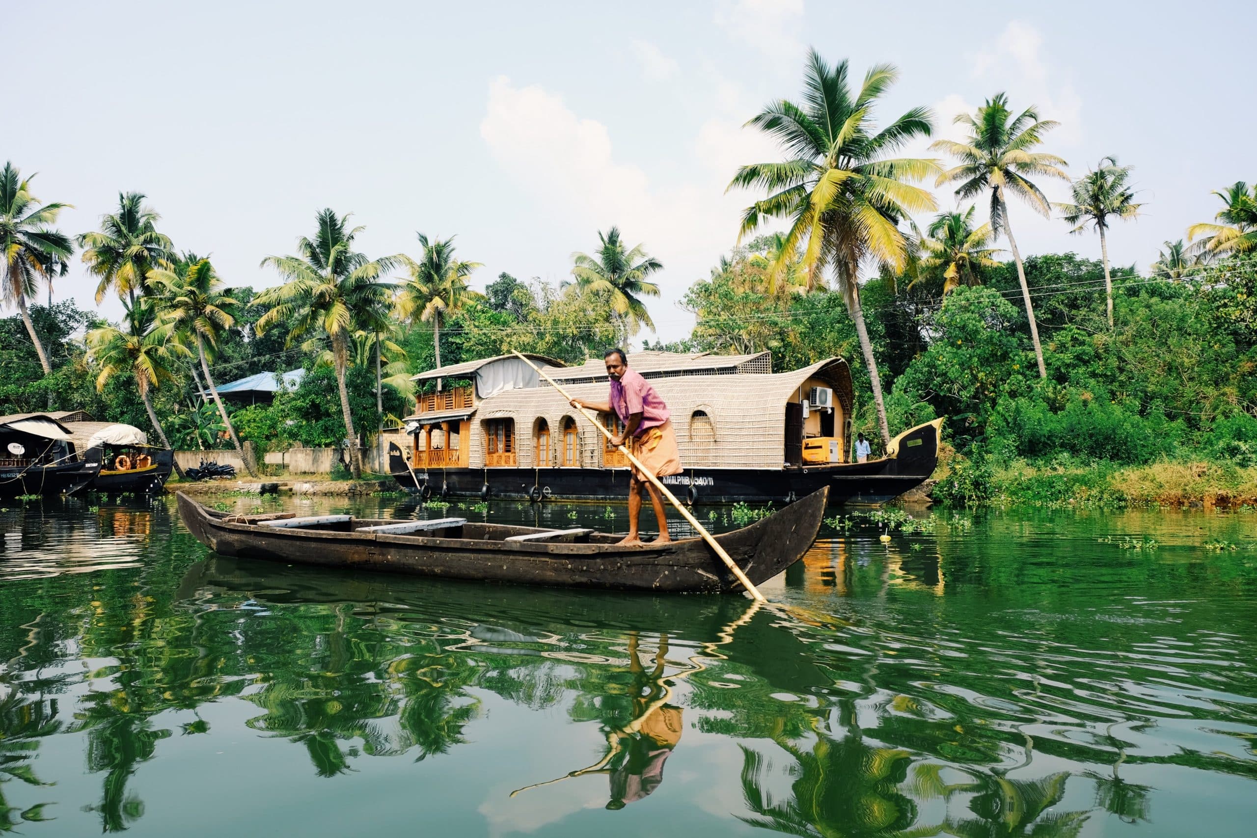 man rowing boat on a river