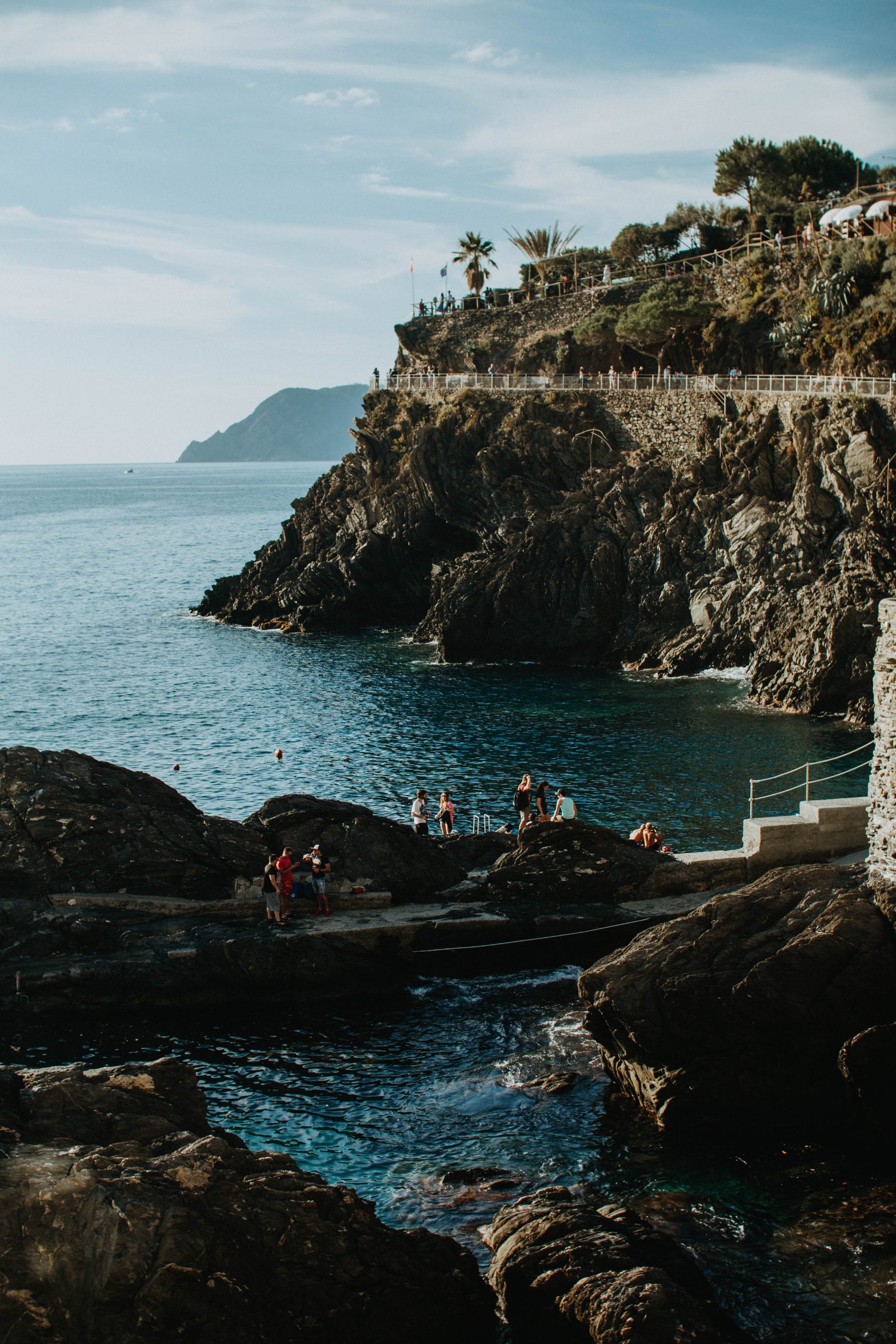 People swimming in Manarola