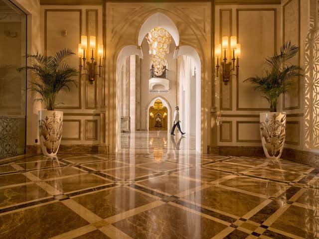 bellboy walking across hotel lobby