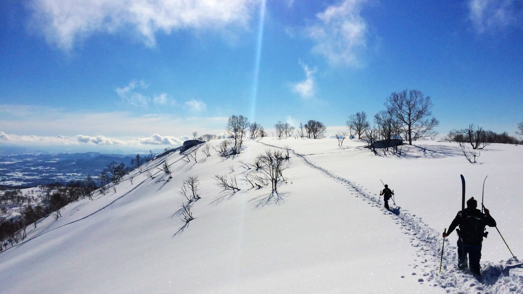 two men hiking in winter niseko hokkaido japan