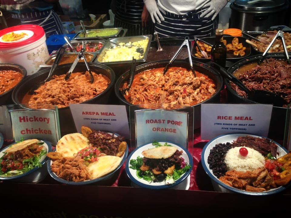 Old Spitalfields Market stall serving Jamaican food in London