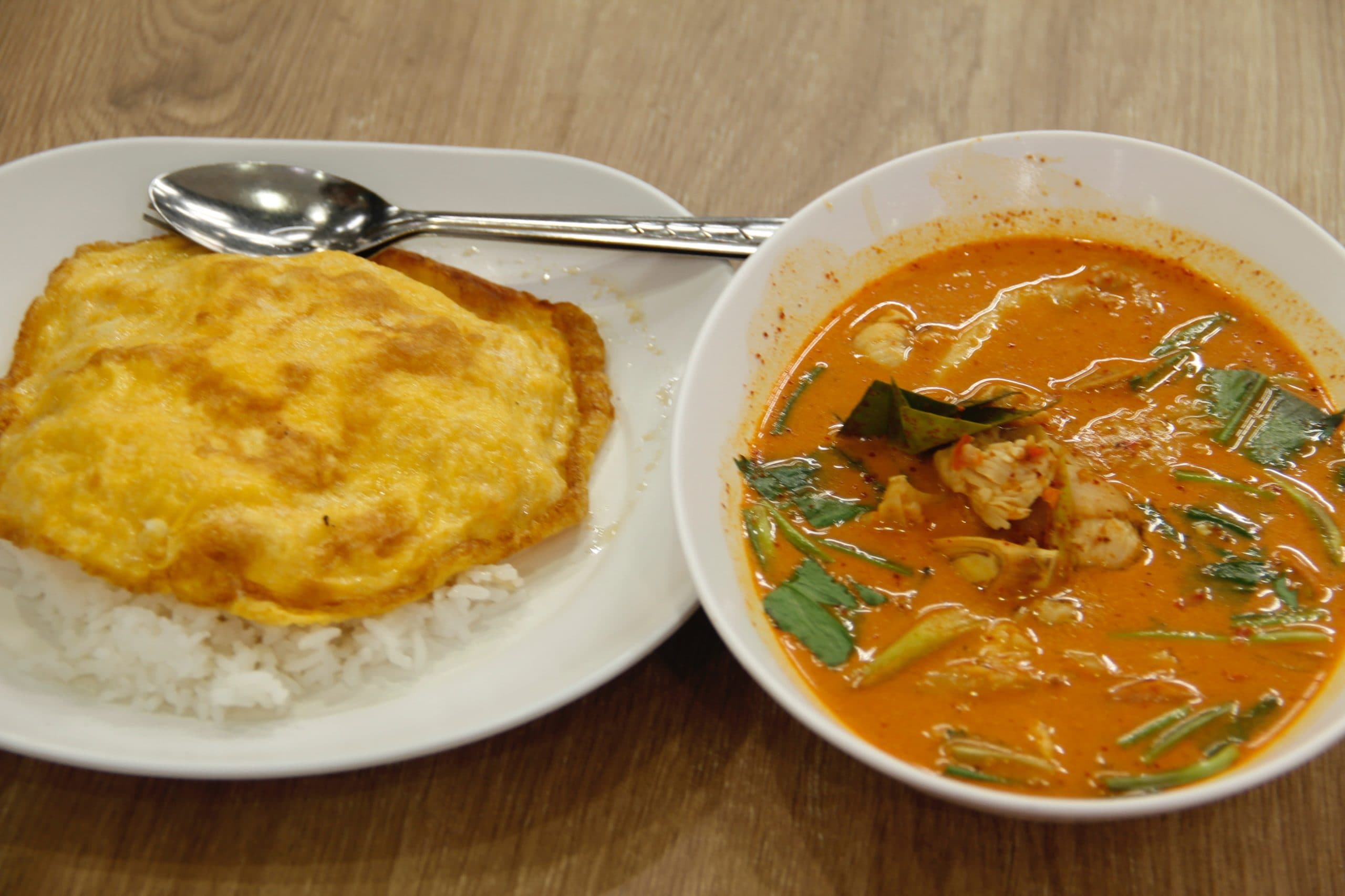 Omelette rice and red curry in Bangkok