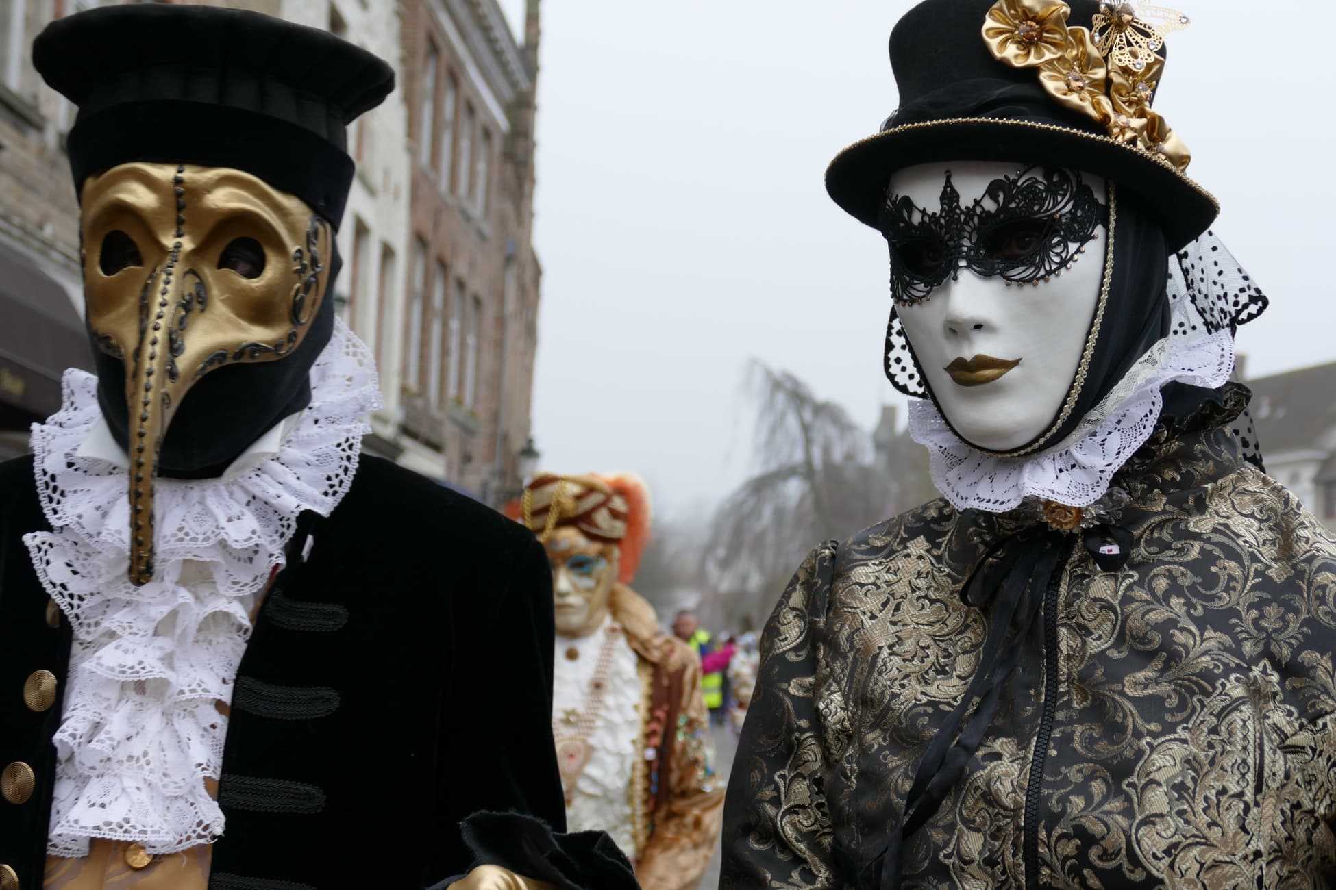 people in costume wearing masks