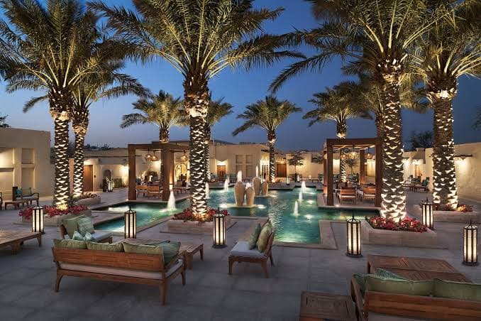 outdoor pool with palm trees