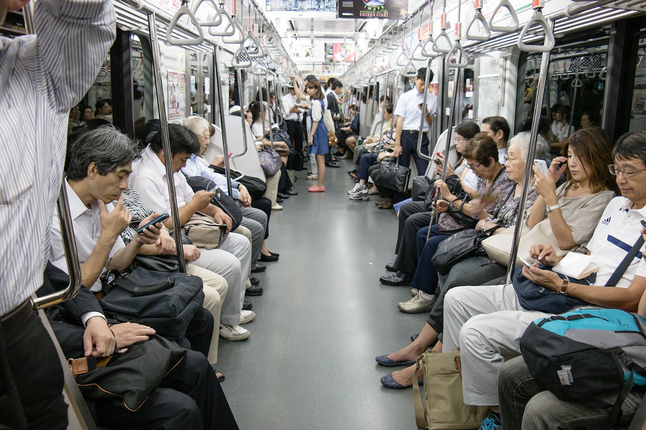 commuters on a subway train in japan