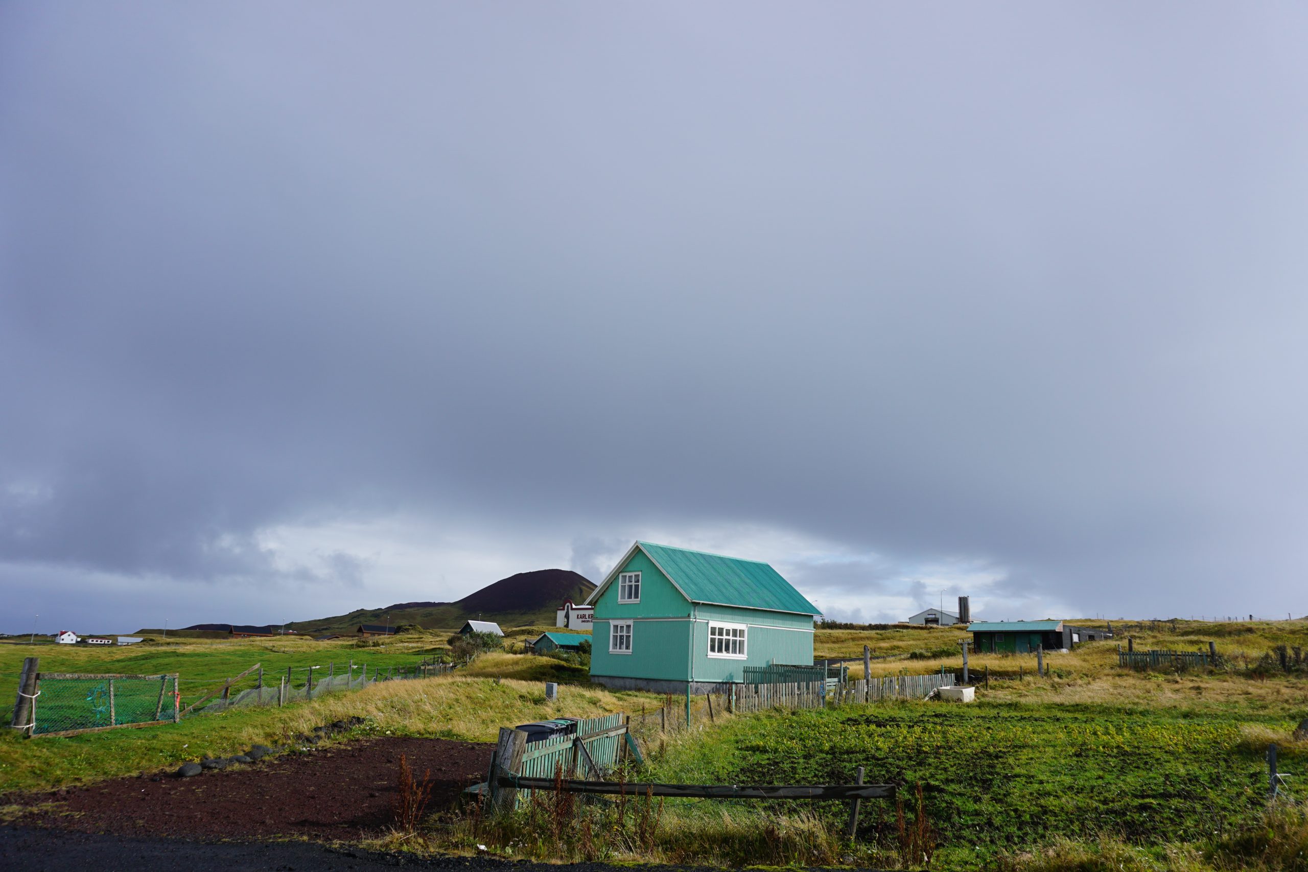 Bright coloured sheds can be seen around the Westman Islands