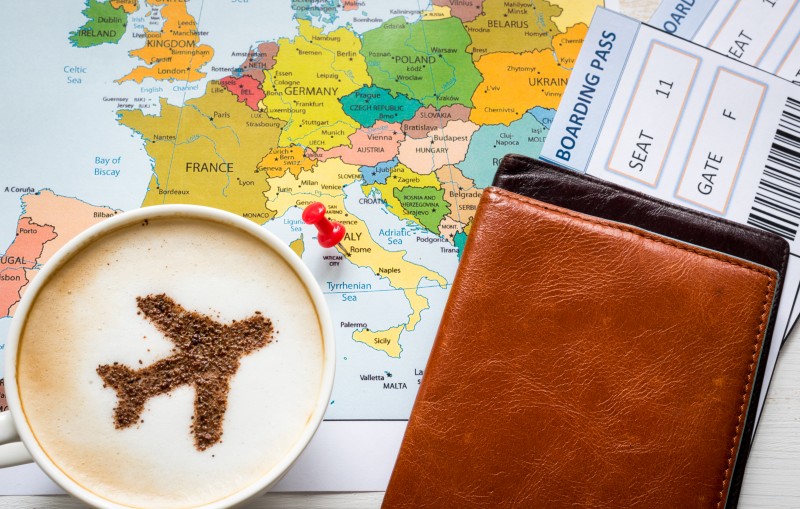 Europe map and airplane in cappuccino (made of cinnamon). Travel concept. Travel agency